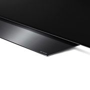 LG BX 55 tuuman 4K Smart OLED TV, Living room with a sofa and a TV showing an aerial view of nature, OLED55BX6LB, thumbnail 12