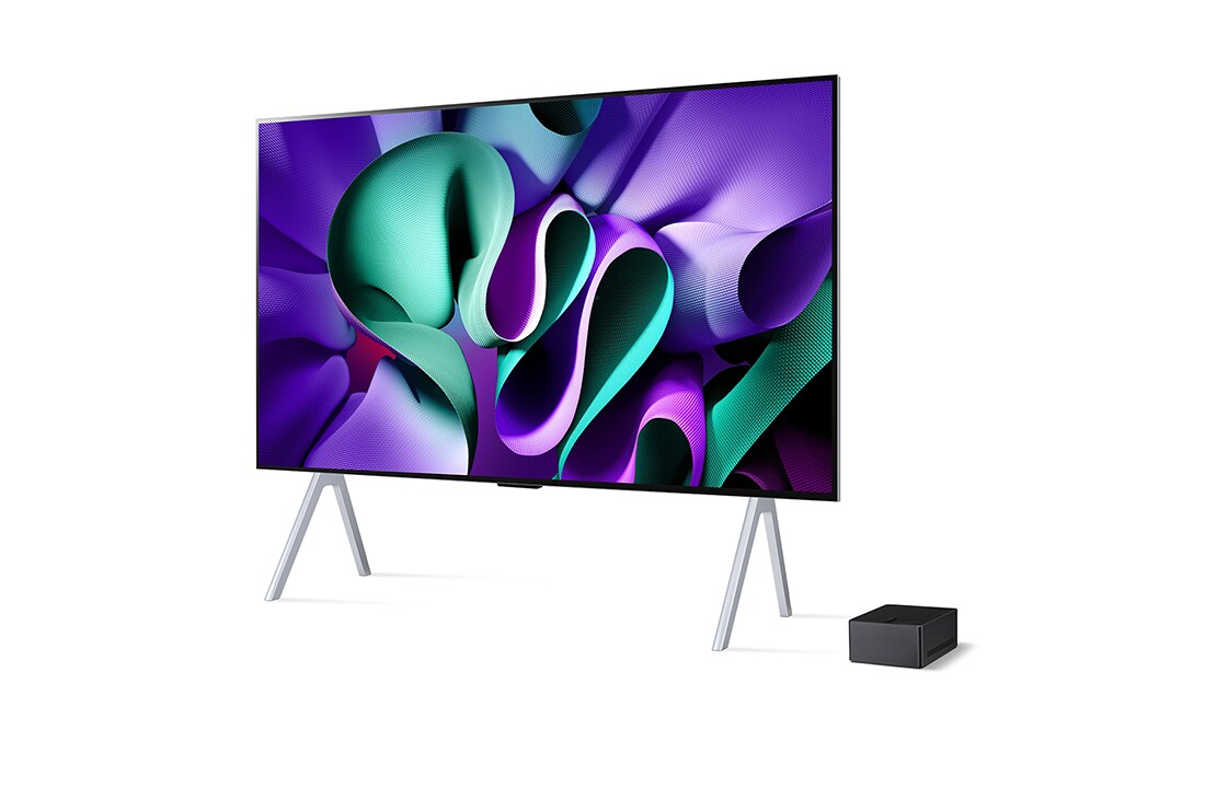 LG 97 tuuman True Wireless LG SIGNATURE OLED M4 -televisio langattomalla 4K 120Hz videon- ja äänensiirrolla , Hieman kallistettu, vasemmalta puolelta otettu kuva tv-tasolle asennetusta LG OLED M4 -laitteesta, jonka alla on Zero Connect Box, OLED97M49LA, thumbnail 3