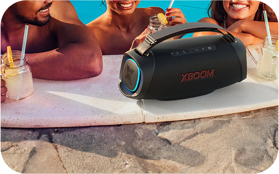 LG XBOOM Go XG8T speaker by a pool with partygoers holding drinks, water-resistant design showcased