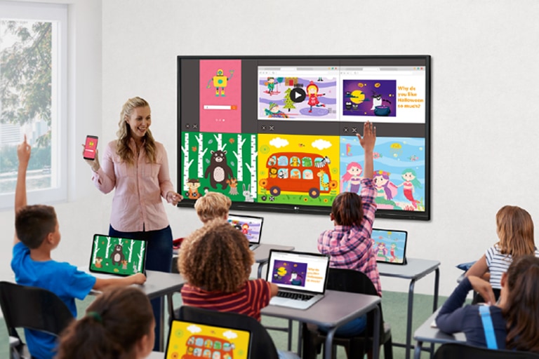 The screens of students' laptops and teacher's mobile are being shared to the display.