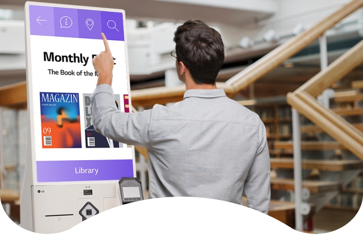 A visitor is looking for some information using the LG Kiosk. The LG Kiosk has a seamless design in two tones of calming beige. It features a 27-inch in-cell display with Full HD and runs on Windows OS.