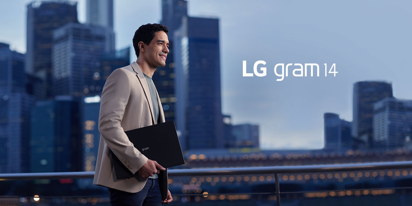 A man is walking with an LG gram.