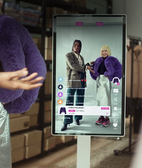 An e-commerce live video is being played on a LG Smart Monitor Swing.	