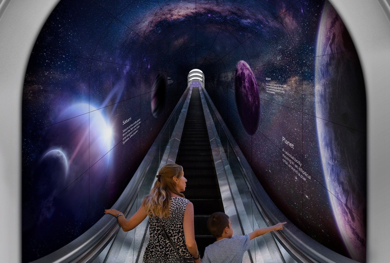 A woman and a child are going up a tunnel made of flexible Curved Open Frame OLED Signage through an escalator.