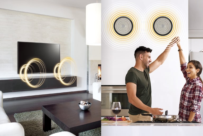 A TV is making sounds in one space, and a man and a woman are listening the sound of TV through external speakers in another space in a hotel room.