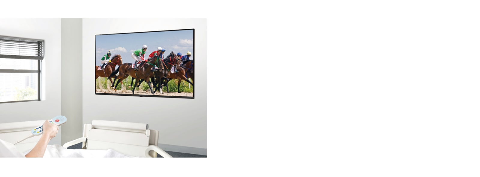 A patient in the hospital room is watching VOD on a TV hanging on the wall without a set-top box.