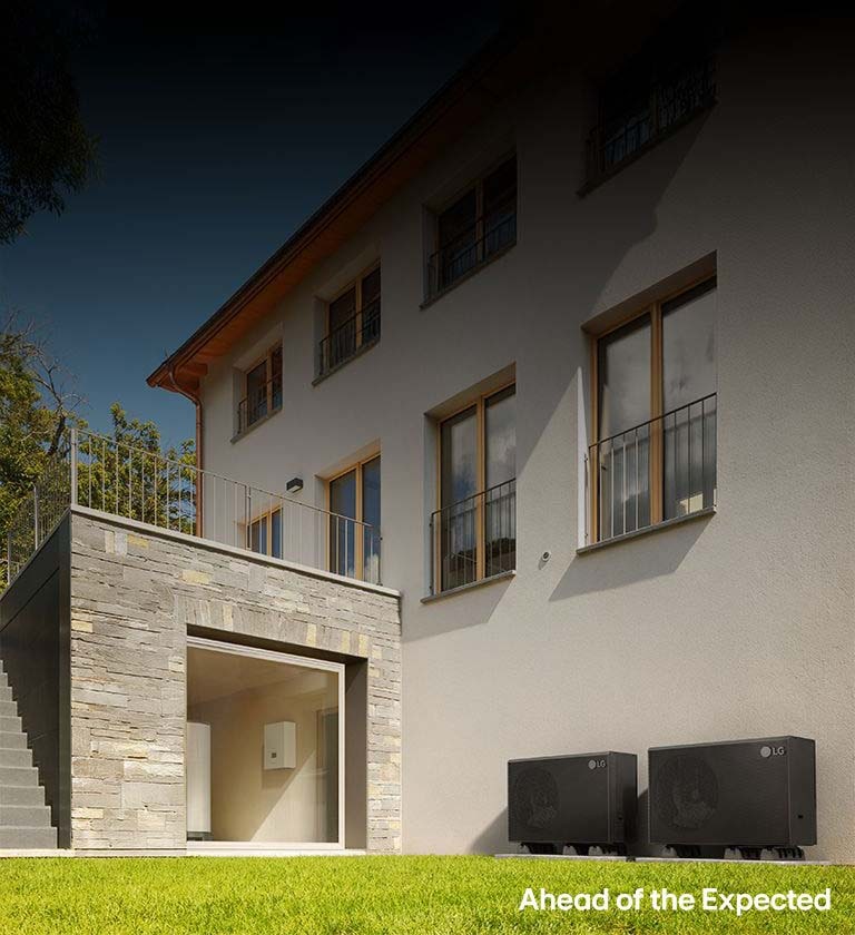 LG HVAC system setup with outdoor and indoor units, plus a wall-mounted control panel in a modern stone house.