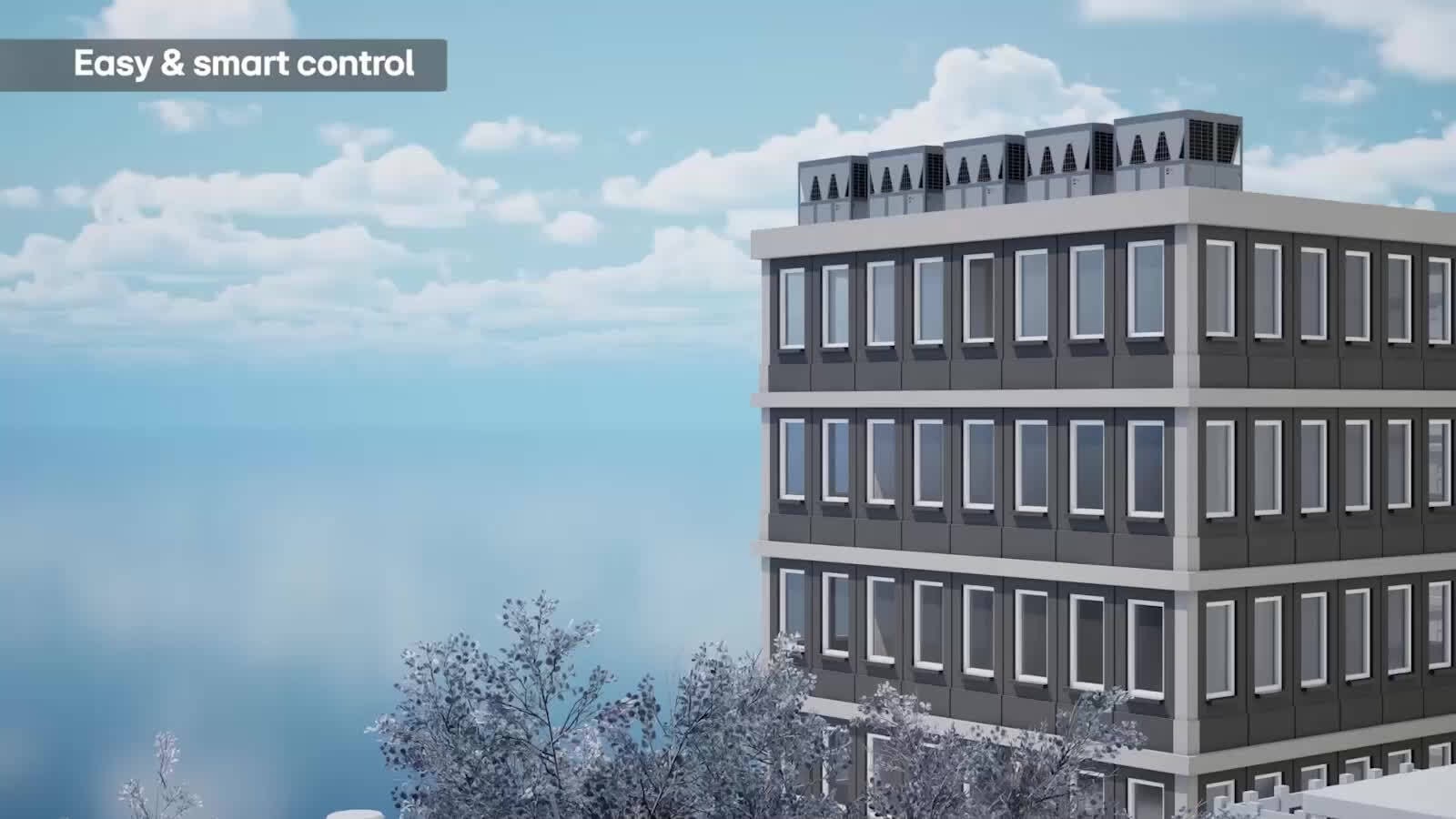 An HMI controller interface for five chiller units on a building rooftop under a clear sky.