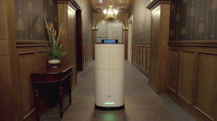 Image of LG CLOi walking through a hotel lobby	