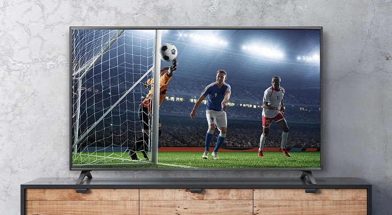 The soccer game scene shown on the TV screen appears real.