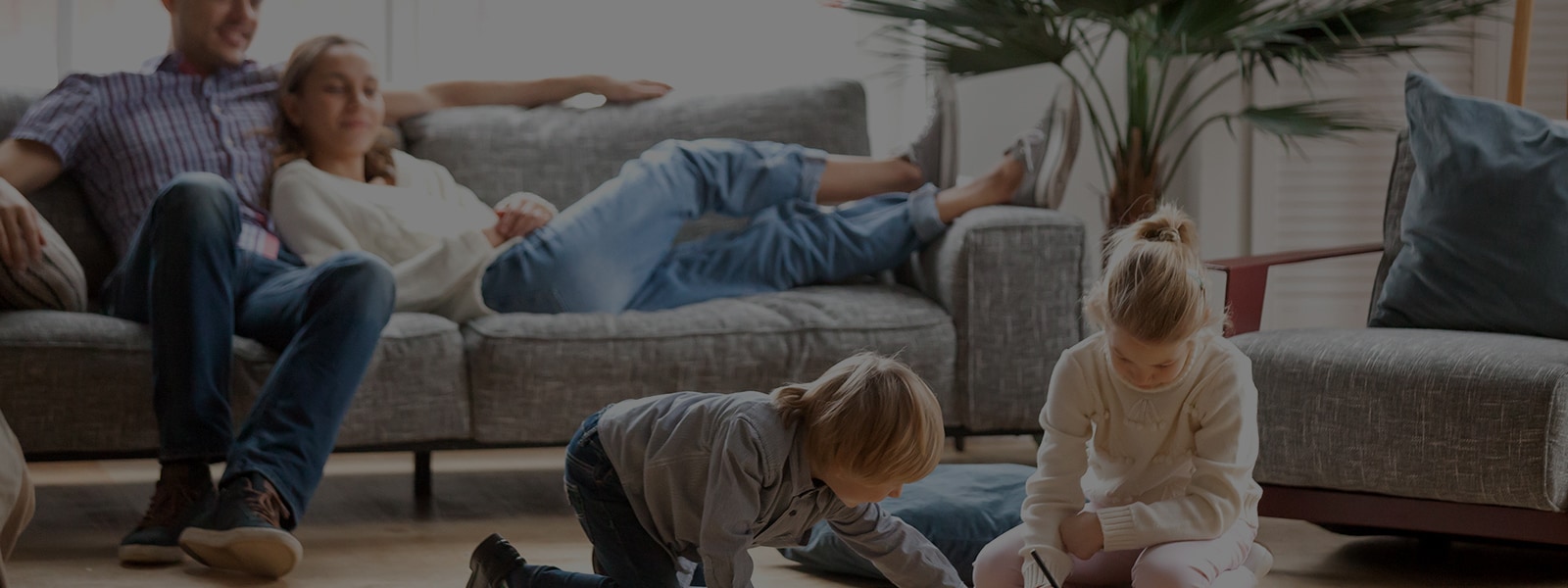 It's an image of four family members resting comfortably in the living room.