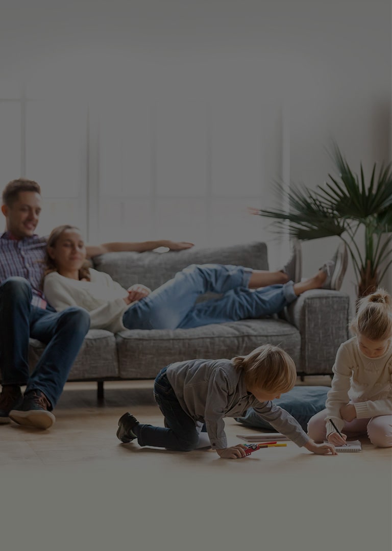 It's an image of four family members resting comfortably in the living room.