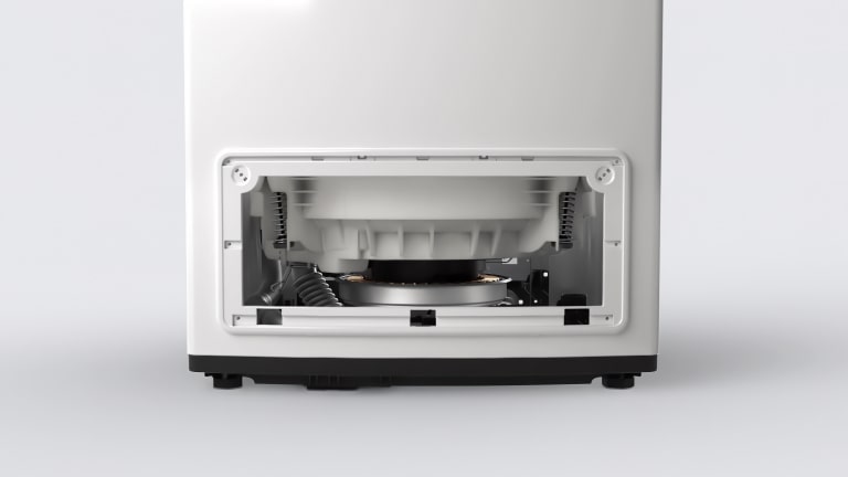 A close-up image of a washing machine with the front panel removed, revealing the internal components. The motor and other parts are clearly visible.