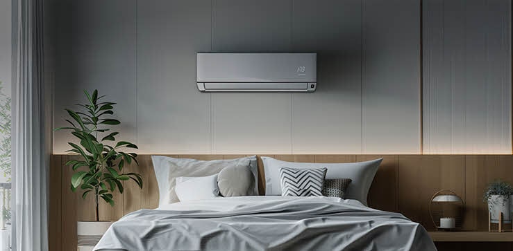 Contemporary bedroom featuring an wall-mounted air conditioner above the bed, providing quiet and efficient cooling in a cozy, natural-toned space.