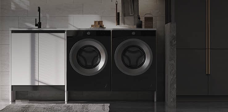 Modern laundry room with two front-loading LG dryers installed side by side under a built-in counter, emphasizing efficient drying solutions for residential use.
