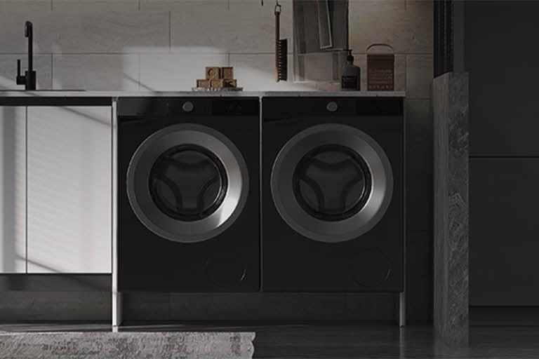 Modern laundry room with two front-loading LG dryers installed side by side under a built-in counter, emphasizing efficient drying solutions for residential use.