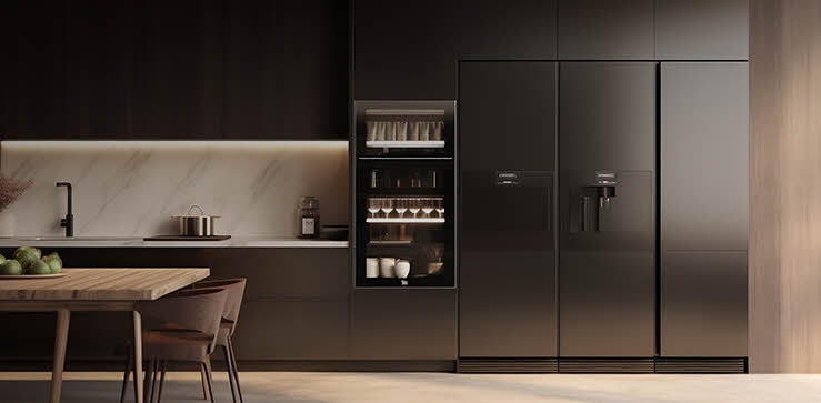 Modern kitchen with a built-in side-by-side refrigerator featuring a sleek matte finish, seamlessly integrated into dark cabinetry for premium residential cooling.