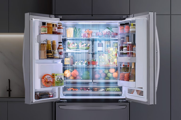 An open refrigeration with vegetables and foods in it