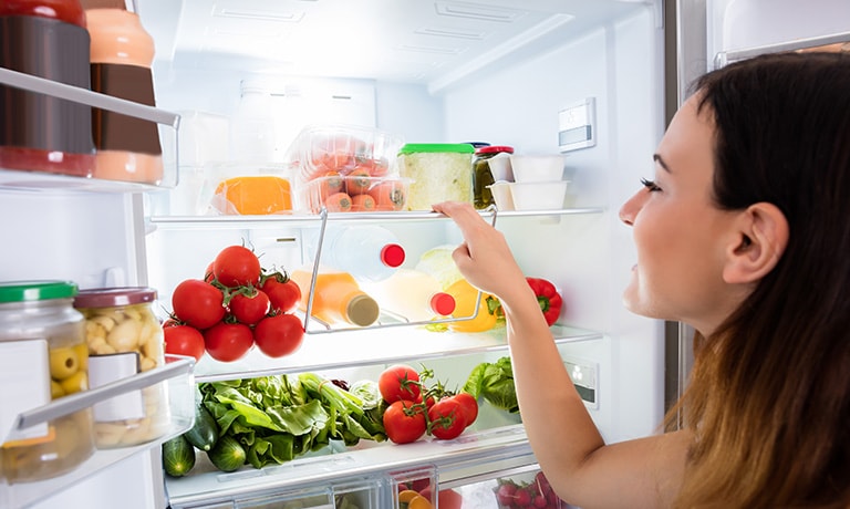 Woman Searching for Food in the Fridge