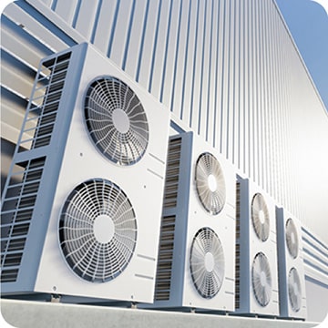 Four Scroll Compressors for residential use are lined up in a row outside.