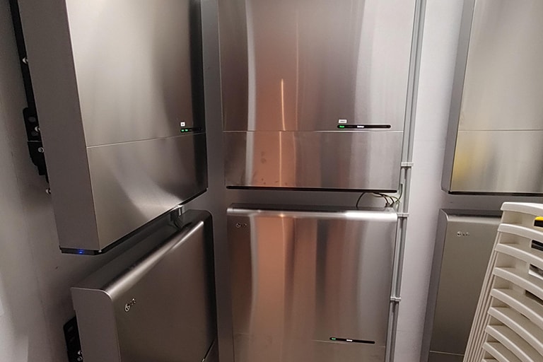 Residential LG ESS units in the corner of a house.