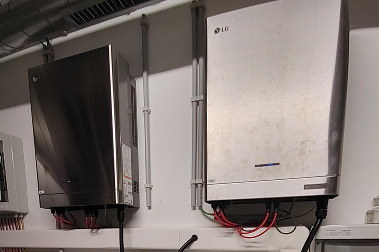 Two residential LG ESS units on a wall.