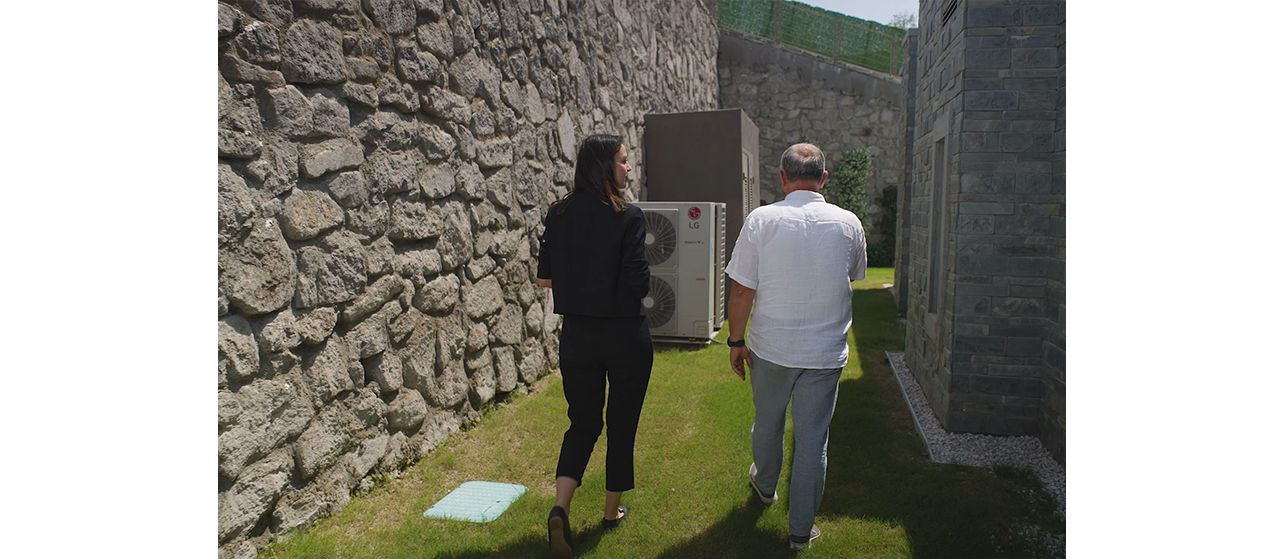A woman and a man walking in the garden