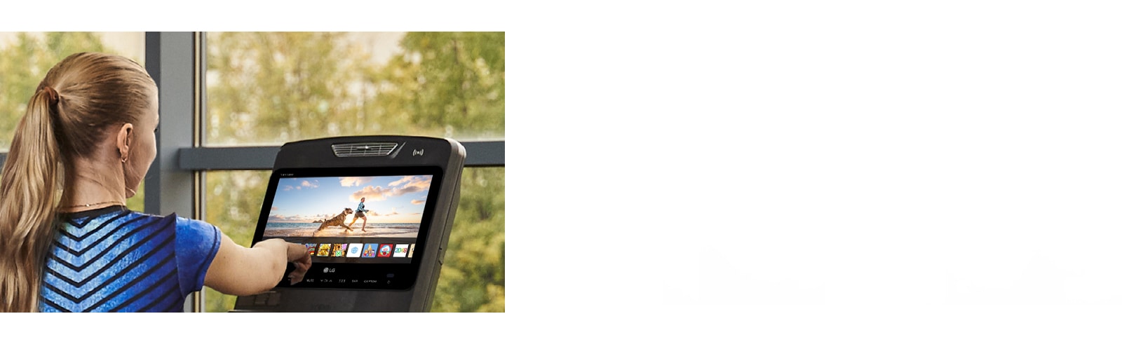 A woman is touching an icon on a TV screen installed on an exercise machine.