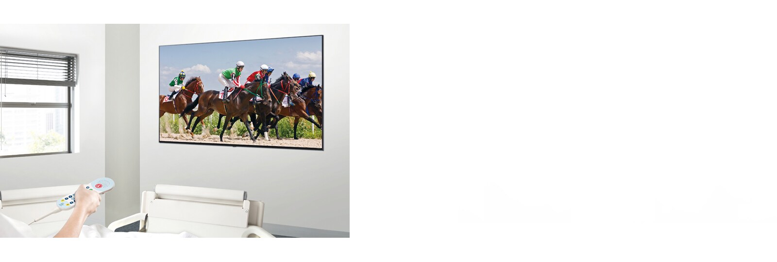 A patient in the hospital room is watching VOD on a TV hanging on the wall without a set-top box.