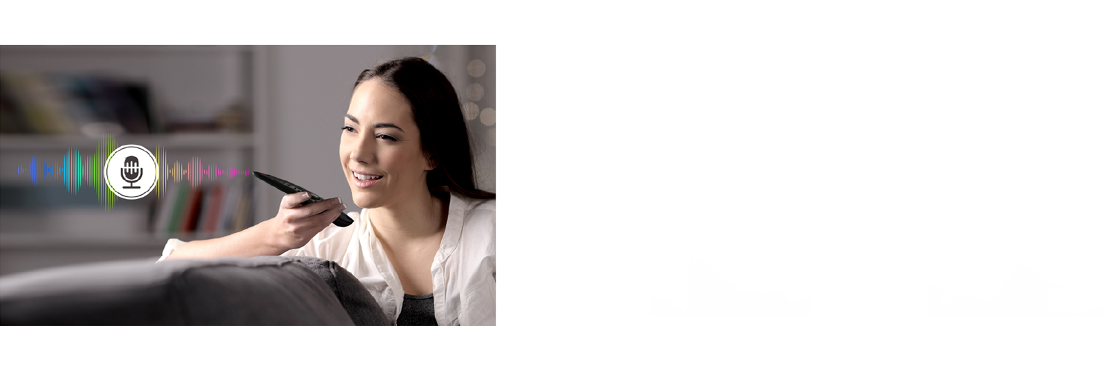 A woman is controlling TV by speaking to a remote control which has voice recognition.