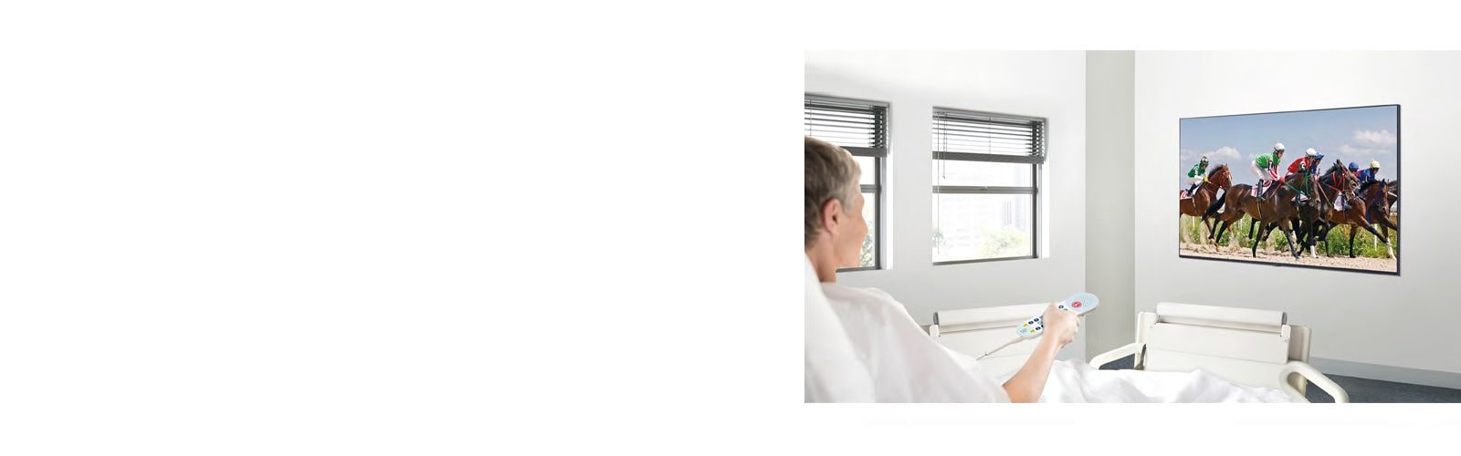 A patient in the hospital room is watching VOD on a TV hanging on the wall without a set-top box.