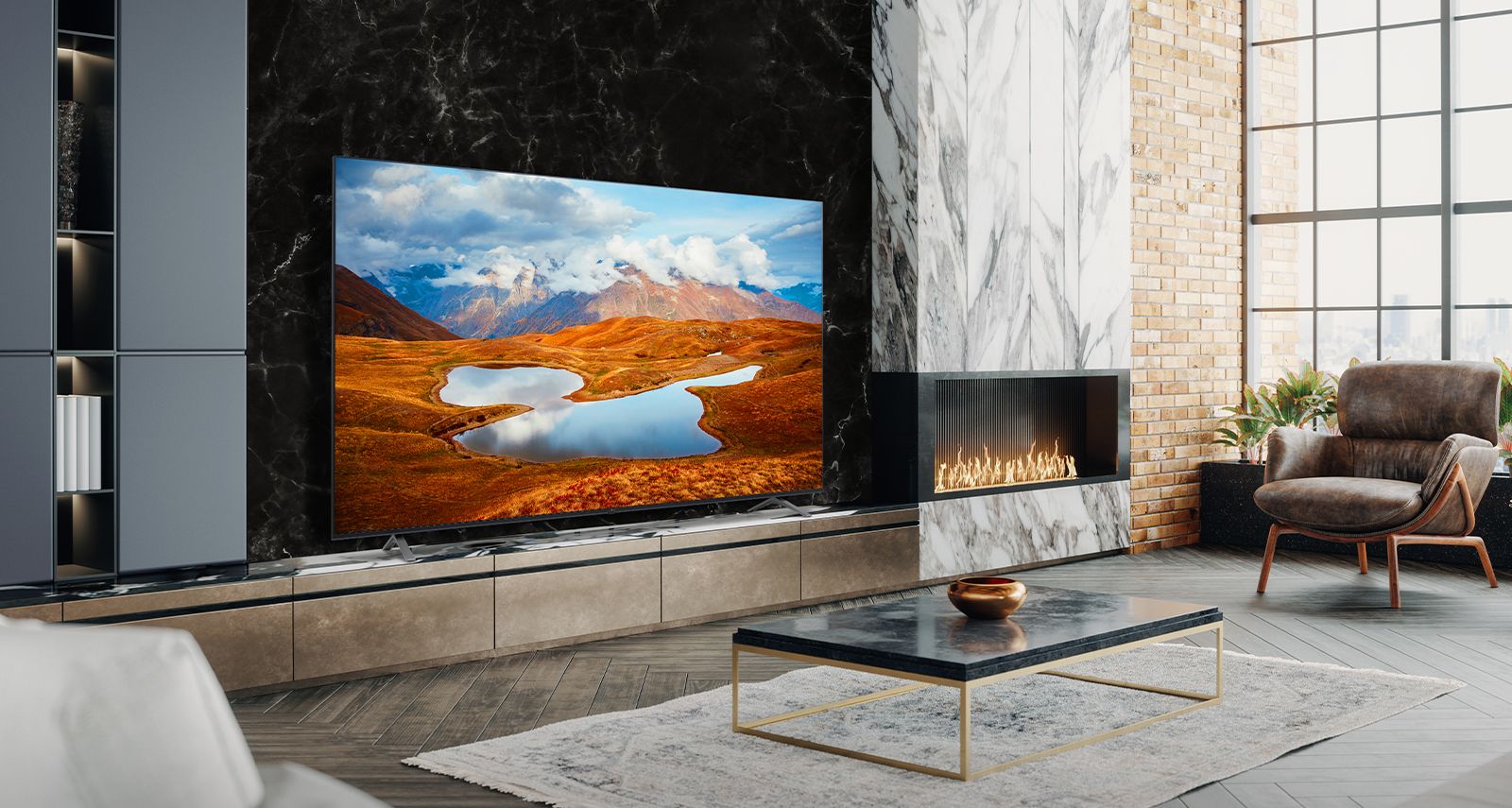 A large TV is placed on a living room wall decorated with a fireplace. Scenery of a mountain at night in which the Milky Way flows is bright and vivid on the TV screen.