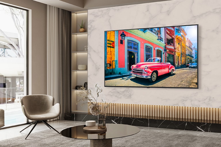 A TV on a hotel wall shows a bright and vivid screen.