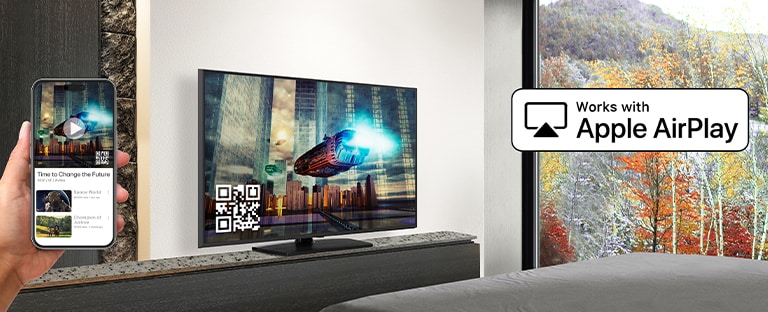 A hotel guest is pairing their iPhone with the in-room TV through AirPlay.