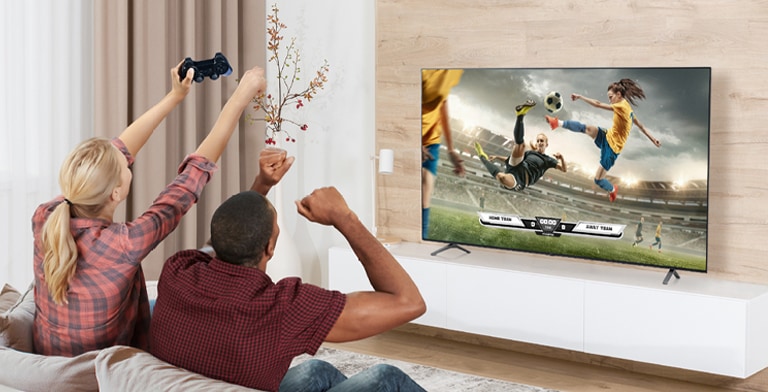 The man and woman are playing games, and the game's scene shown on the TV screen is realistically expressed.