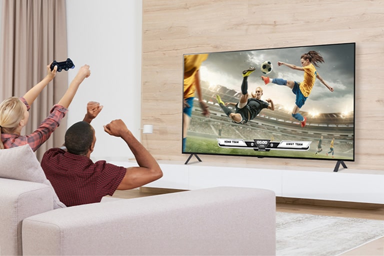 The man and woman are playing games, and the game's scene shown on the TV screen is realistically expressed.