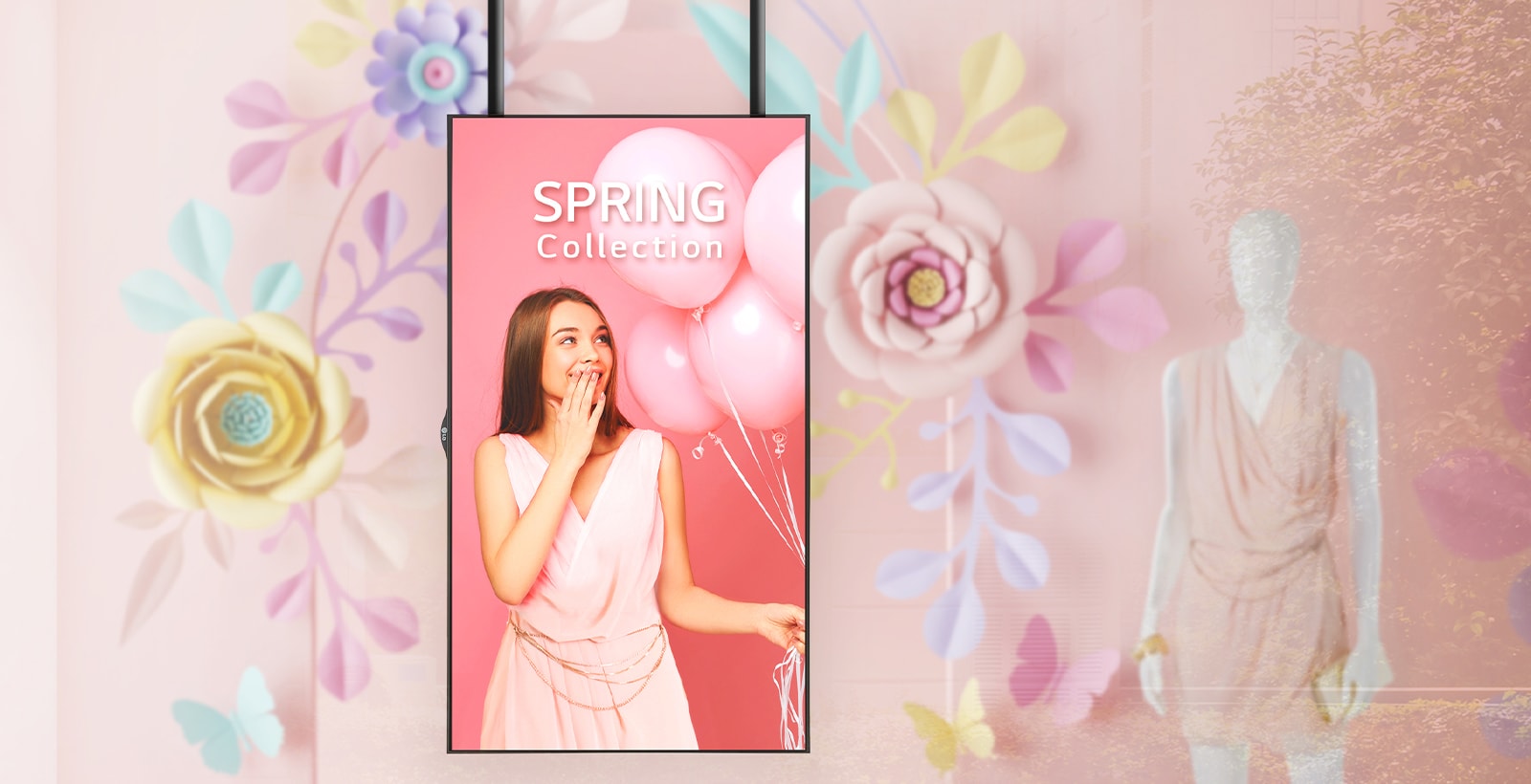 The slim bezel display installed next to a mannequin in a shop window clearly shows the promotional ads to customers.