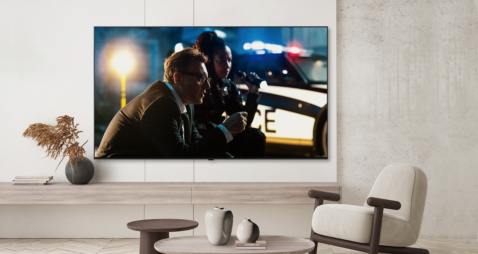 A TV by a hotel’s wall shows a bright and vivid screen.