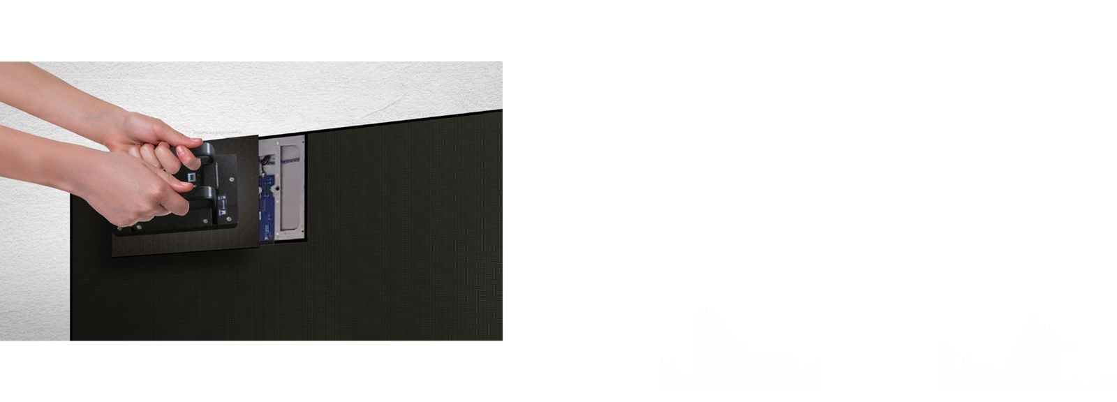 A person replaces one of the LED modules from the front by using the magnetic tool provided.