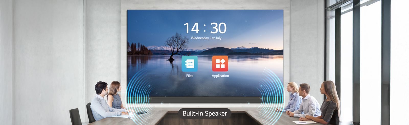 People have a meeting while watching the display and listening to sound from the built-in speakers of the LABB installed in the meeting room.