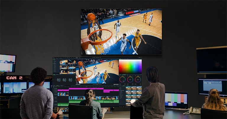 A basketball game broadcast is being monitored on the 65EP5Q, which displays consistent and accurate colors across the entire screen without distortion, regardless of viewing angle.