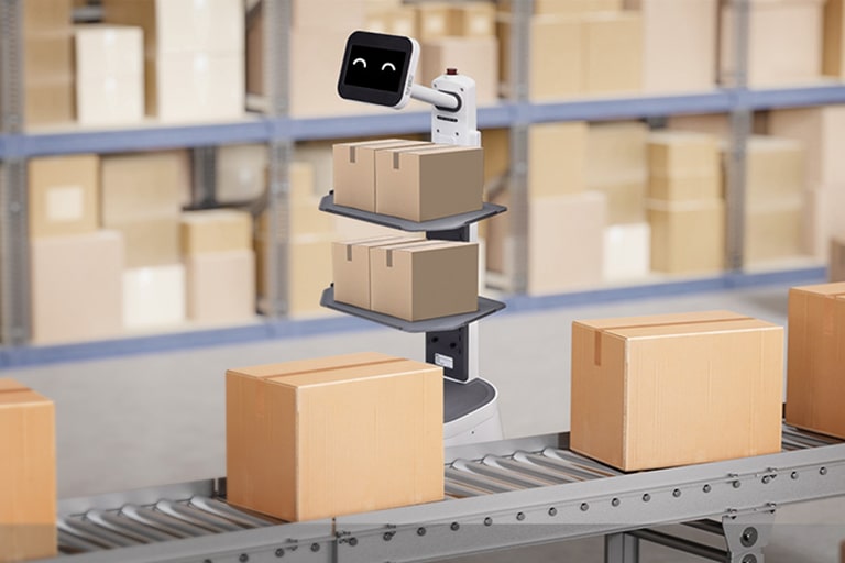 LG CLOi CarryBot is carrying two small boxes on each tray working right near the conveyor belt with smile on LCD display	