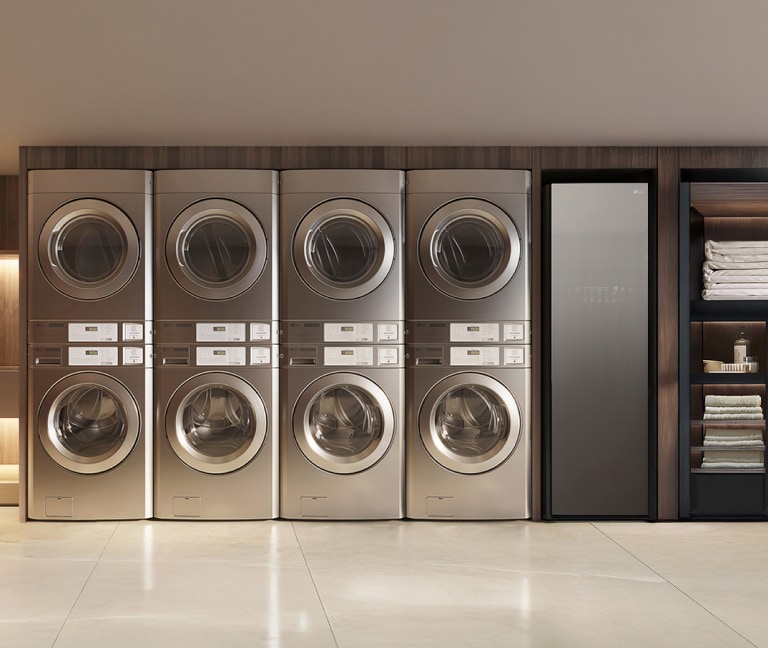 LG Commercial Laundry showcases a modern setup with stacked washers and dryers alongside an LG Styler, offering a sleek and efficient solution for laundry facilities.