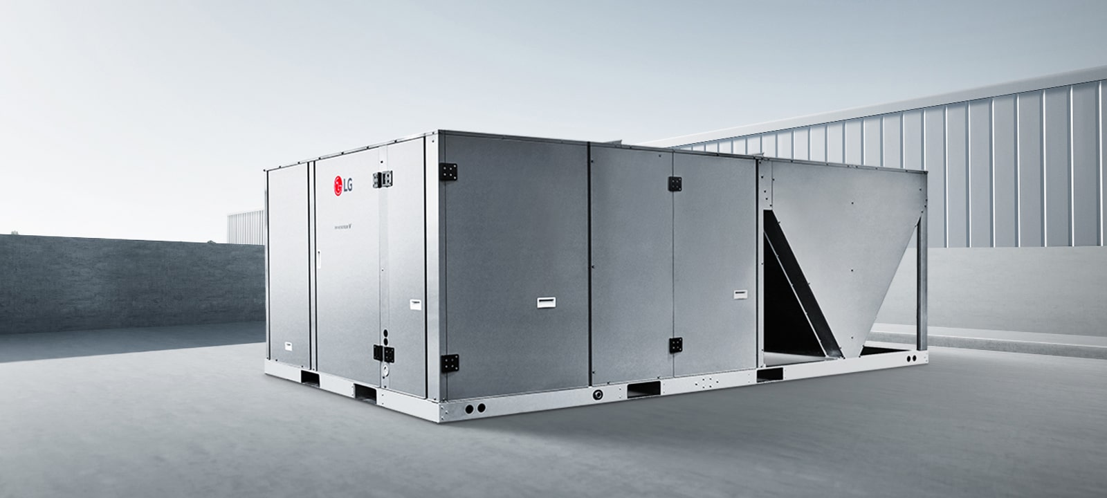 LG Inverter Single Package on a concrete platform with a clear sky and a building in the background.