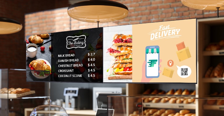 This image shows digital signage inside a cafe displaying an ad for fast delivery services.