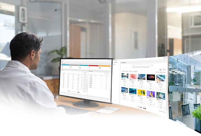An IT administrator is monitoring devices while viewing the dashboard and equipment management screen of the LG SuperSign Control+ solution.