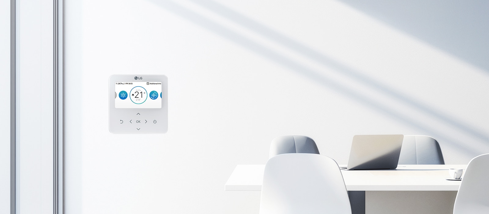 The image shows a clean office space with an LG control panel mounted on a white wall. The control panel displays a temperature setting of '21°C.