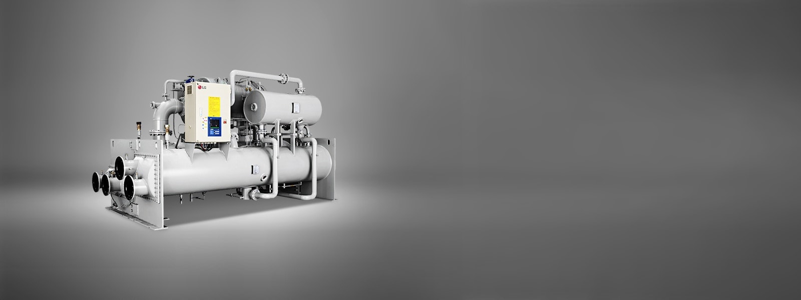 LG Ice Thermal Storage Centrifugal Chiller, showcased in a dark grey hue, consists of a series of linear and cylindrical pipe assemblies.