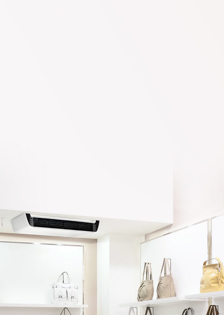 LG Ceiling Suspended unit, featuring a white body with a black front structure, is mounted on the ceiling adorned with a series of lights.