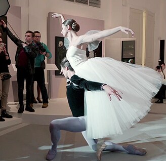 two ballerinas are performing on the stage at the lg signature artweek 2018 in russia